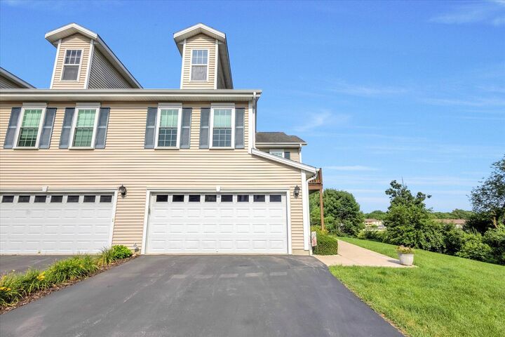 Property Photo:  1203 Woodbury Cmn D  WI 53189 