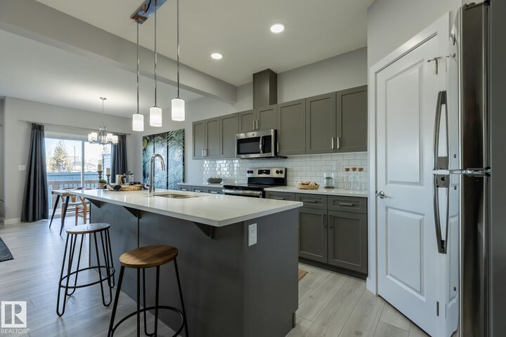 Property Photo:  10716 99 Street  AB T8R 2R8 