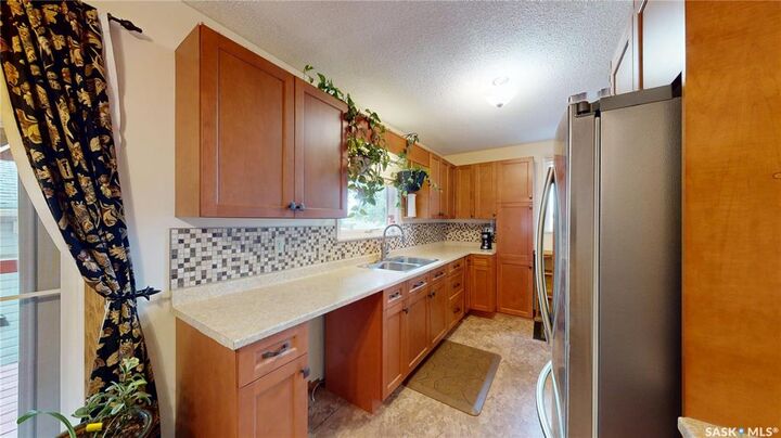 Property Photo:  1101 McNaughton Avenue  SK S7M 3X6 