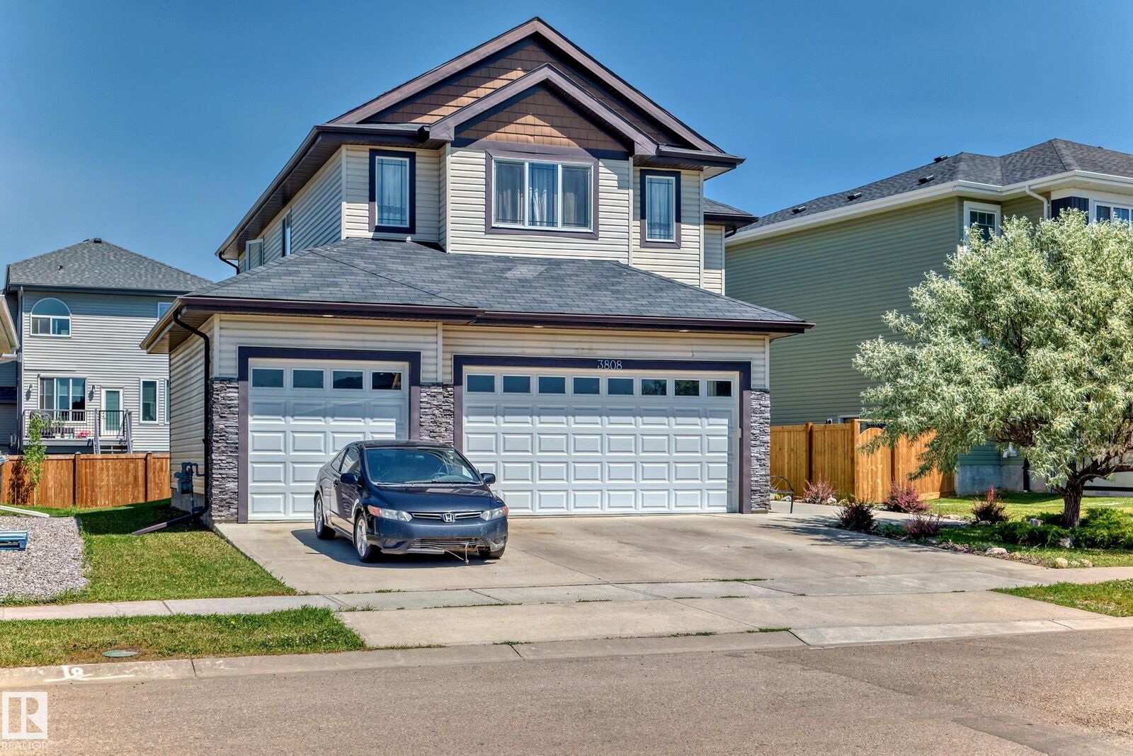 Property Photo:  3808 Triomphe Bv  AB T4X 0C4 