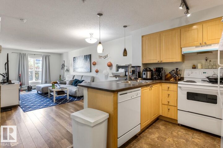 Property Photo: 622 McAllister Loop SW 213 AB T6W 1N2