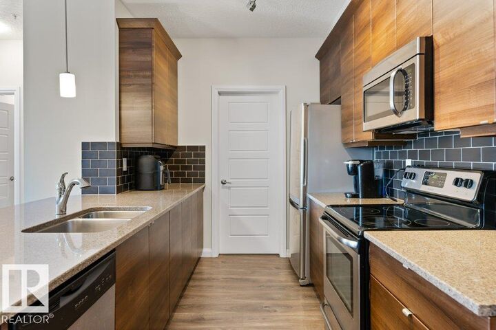 Property Photo: 2588 Anderson Way SW 216 AB T6W 0R2