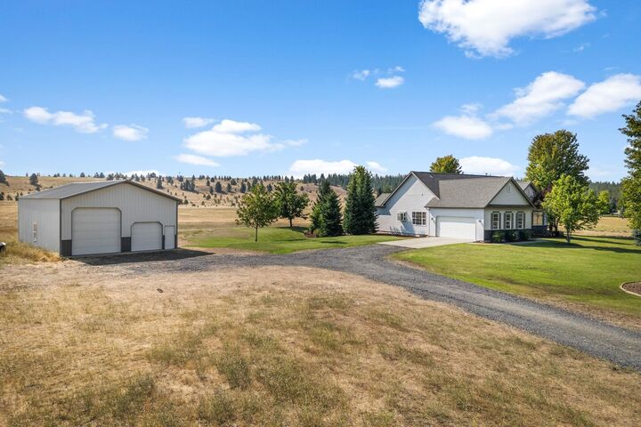 Property Photo:  6915 W Rutter Pkwy  WA 99208 