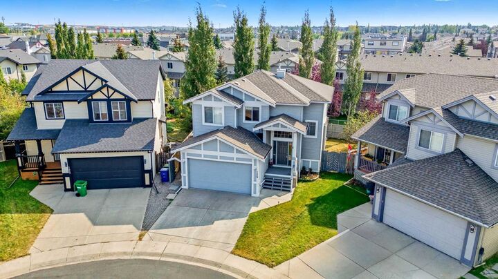 Property Photo:  129 Luxstone Green SW  AB T3B 3B9 