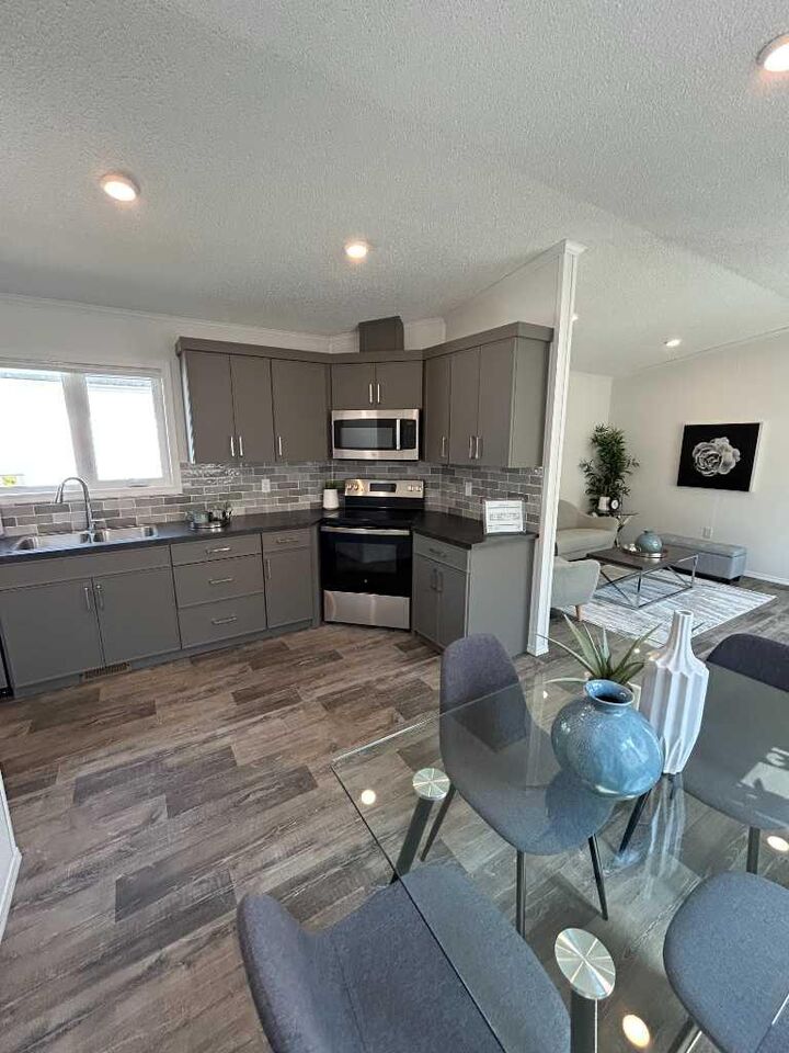 Property Photo: 140 Caouette Crescent AB T9K 2H5