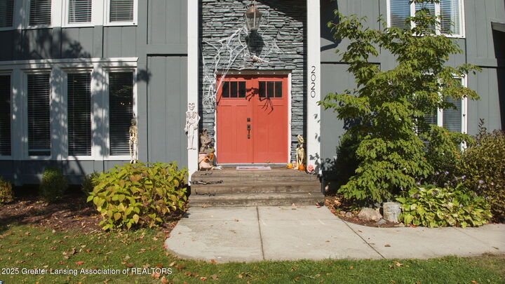 Property Photo:  2020 Tamarack Drive  MI 48864 