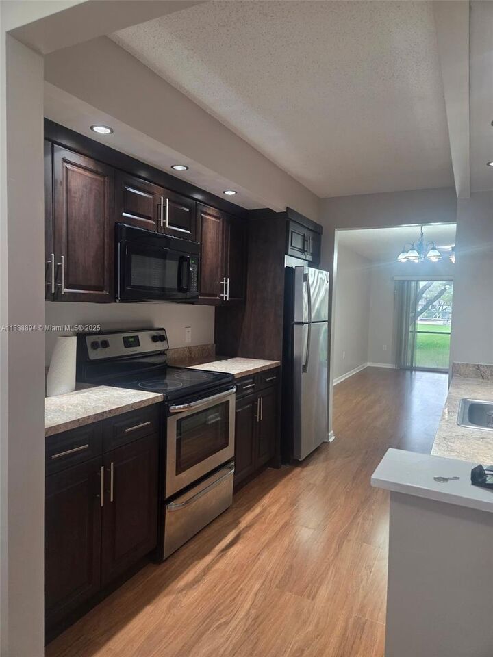 Property Photo: 1200 SW 137th Ave 110E FL 33027