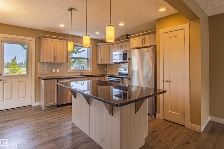 Property Photo: 2121 Haddow Drive NW 32 AB T6R 0W6