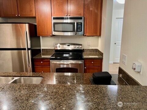 Property Photo:  14200 SE 6th Street 84  WA 98007 