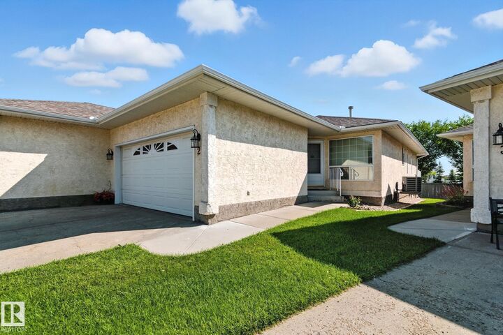 Property Photo: 14428 Miller Blvd NW 2 AB T5Y 2Y6