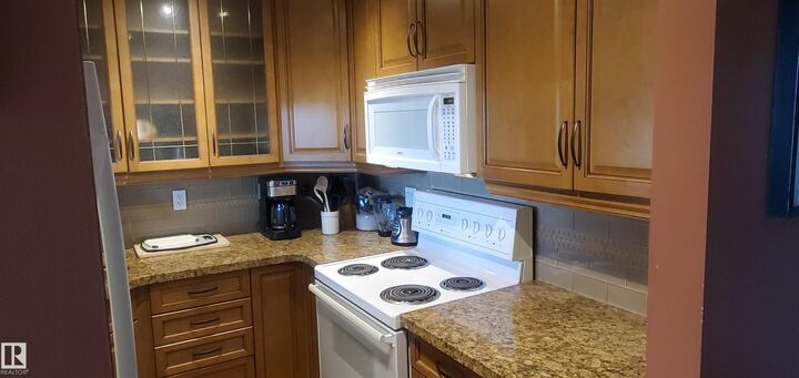 Property Photo: 5520 Riverbend Road NW 415 AB T6H 5G9