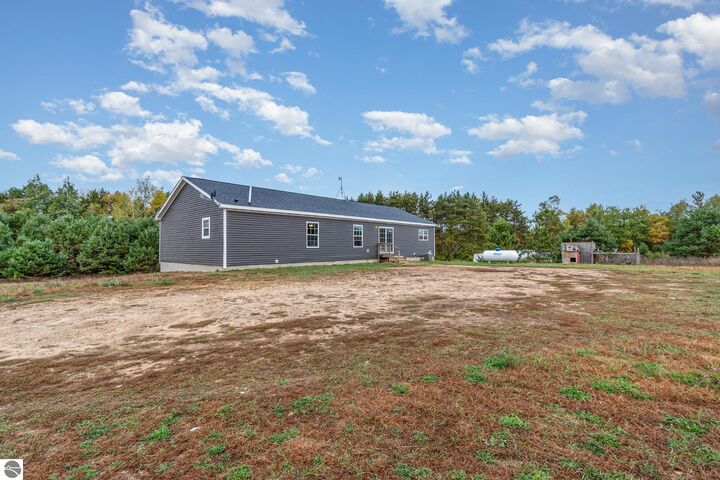 Property Photo:  8770 N Vickeryville Road  MI 48891 