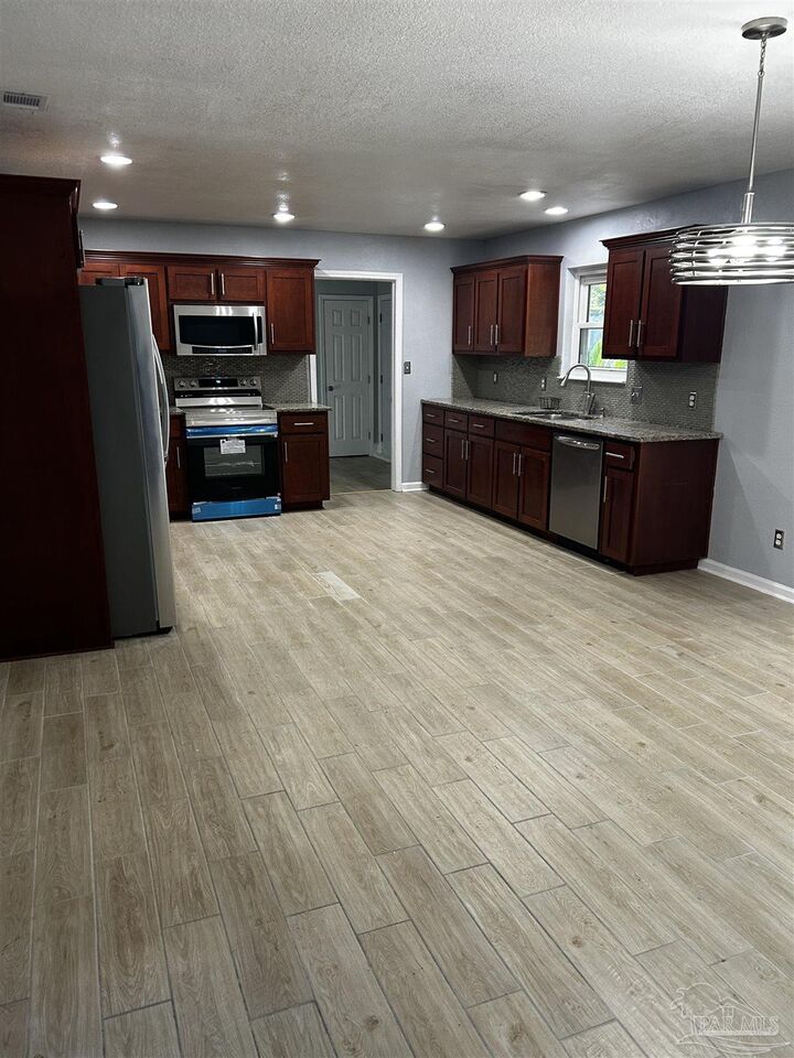 Property Photo:  7911 Burstaff Rd  FL 32514 