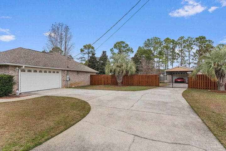 Property Photo:  5692 Als Way  FL 32583 