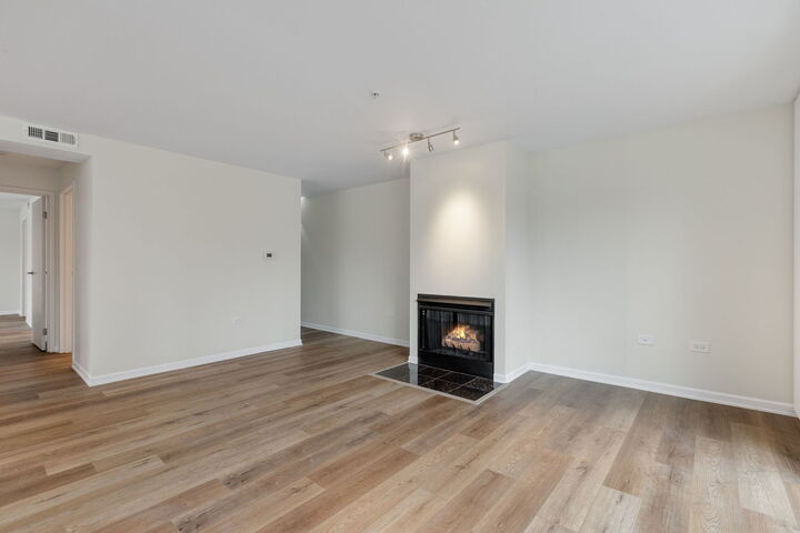 Property Photo:  1800 Dewes Street 202  IL 60025 