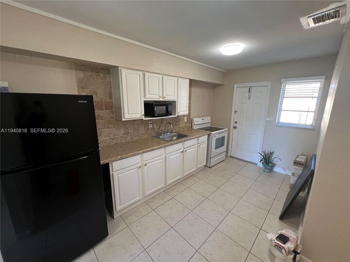 Property Photo:  6100 Garfield St A  FL 33024 
