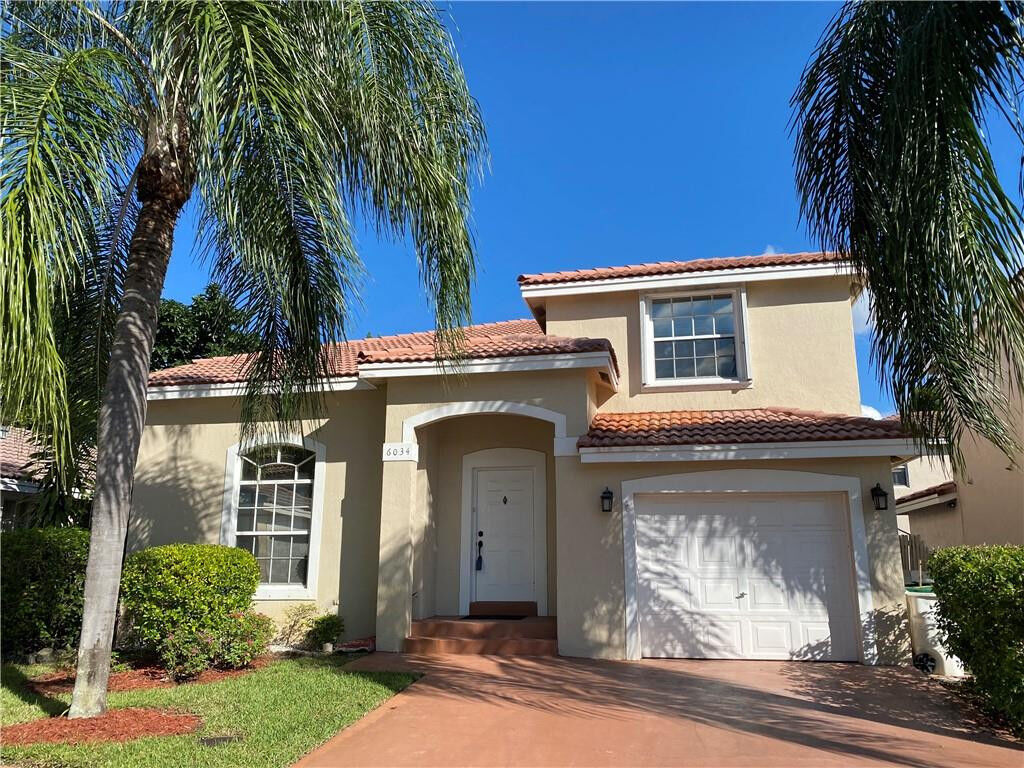 Property Photo:  6034 NW 45th Way  FL 33073 