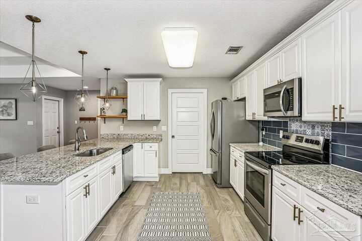 Property Photo:  5063 Bonita Ave  FL 32563 