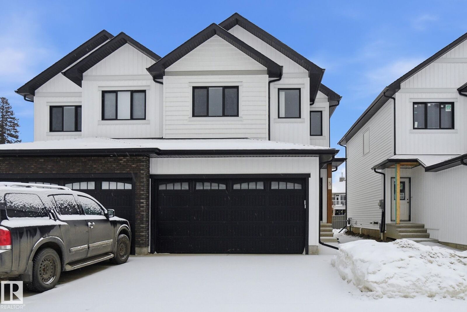 Property Photo:  5122 213A Street NW 5  AB T6M 1M6 