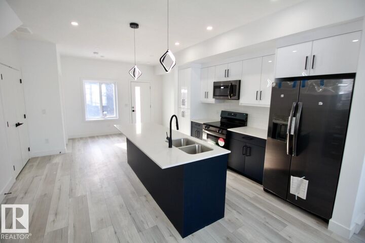 Property Photo:  12224 126 Street NW Main  AB T5L 0W8 