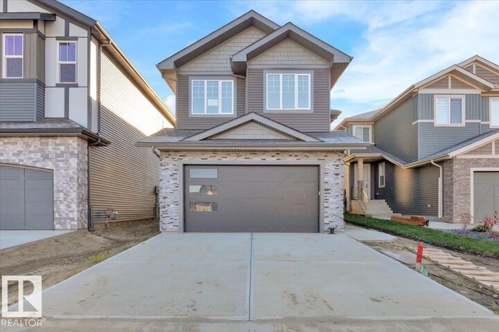 Property Photo:  1115 Gyrfalcon Crescent NW  AB T5S 0S1 