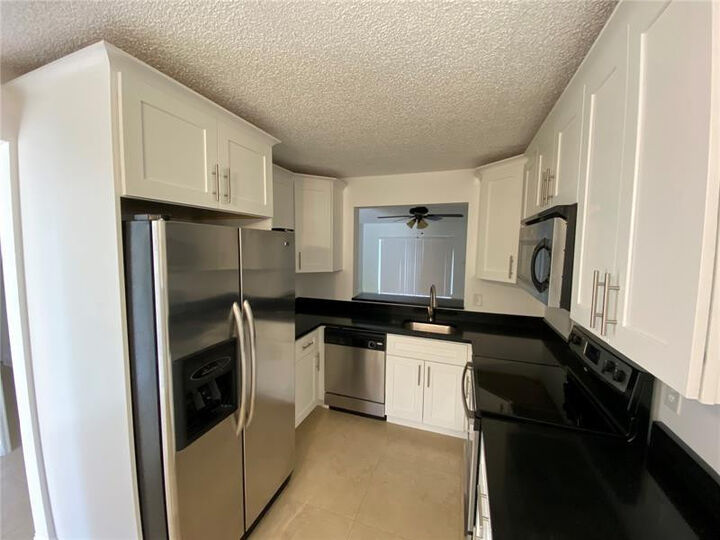 Property Photo:  23466 SW 57th Avenue 504  FL 33428 