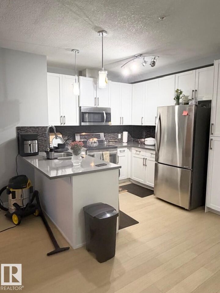 Property Photo:  5151 Windermere Bv SW 706  AB T6W 2K4 