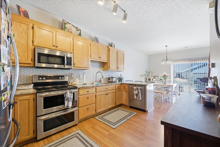 Property Photo:  16812 Embers Avenue 2002  MN 55024 