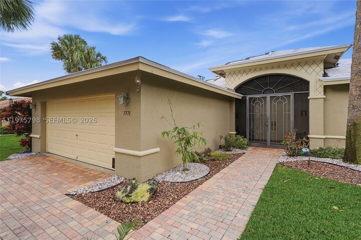 Property Photo:  7771 Via Grande  FL 33437 