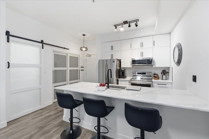 Property Photo:  10088 148th Street 111  BC V3R 3M9 