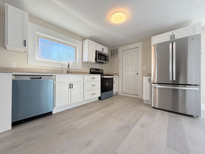 Property Photo:  8 Holman Street  NH 03221 