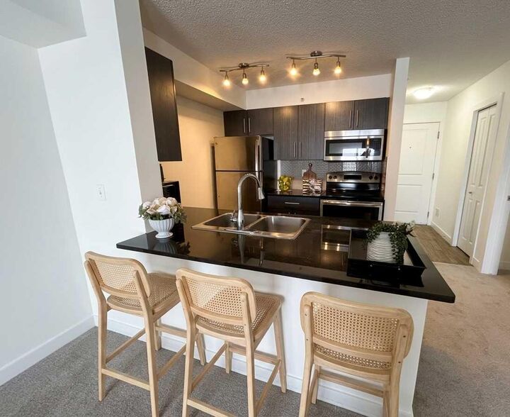 Property Photo:  5 Saddlestone Way NE 412  AB T3J 0S2 