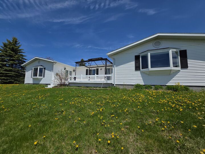 Property Photo:  216 Riverside Drive  MI 49721 