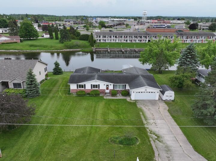 Property Photo:  216 Riverside Drive  MI 49721 