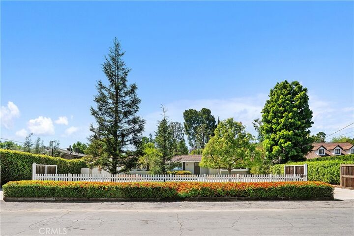 Property Photo:  5823 Lubao Avenue  CA 91367 