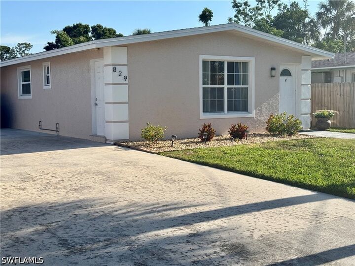 Property Photo:  829 107th Avenue N Unit 1  FL 34108 