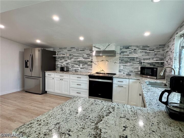 Property Photo: 829 107th Avenue N Unit 1 FL 34108