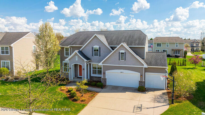 Property Photo:  2611 Lupine Drive  MI 48864 