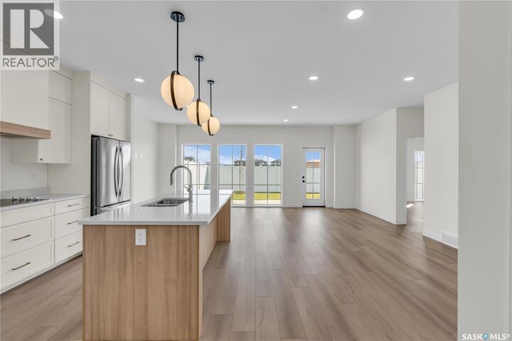 Property Photo:  4 720 Brighton Boulevard  SK S7V 1X1 