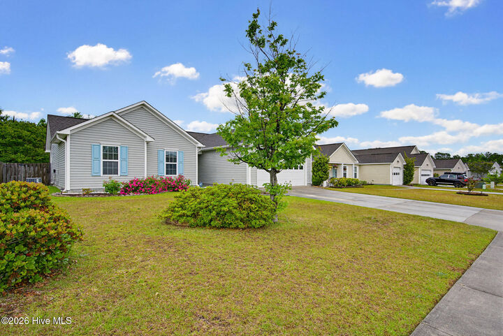 Property Photo:  208 Red Carnation Drive  NC 28445 