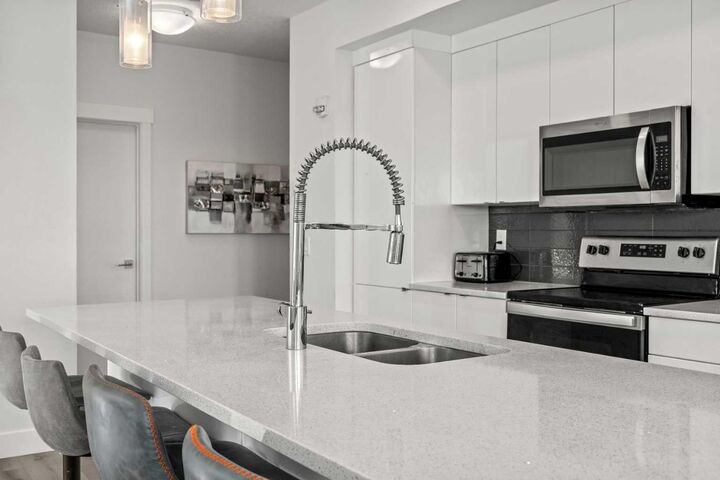 Property Photo: 19661 40 Street SE 305 AB T3M 3H3