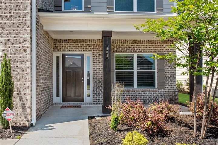 Property Photo:  582 Eagles Nest Circle  GA 30011 