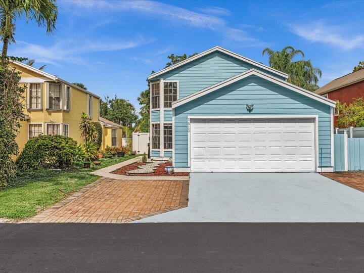 Property Photo: 5610 Dewberry Way FL 33415