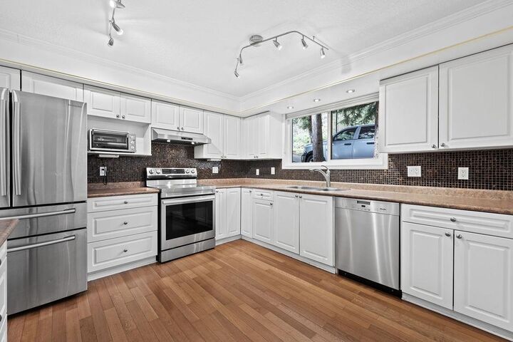 Property Photo:  407 Dartmoor Drive  BC V3K 5V3 