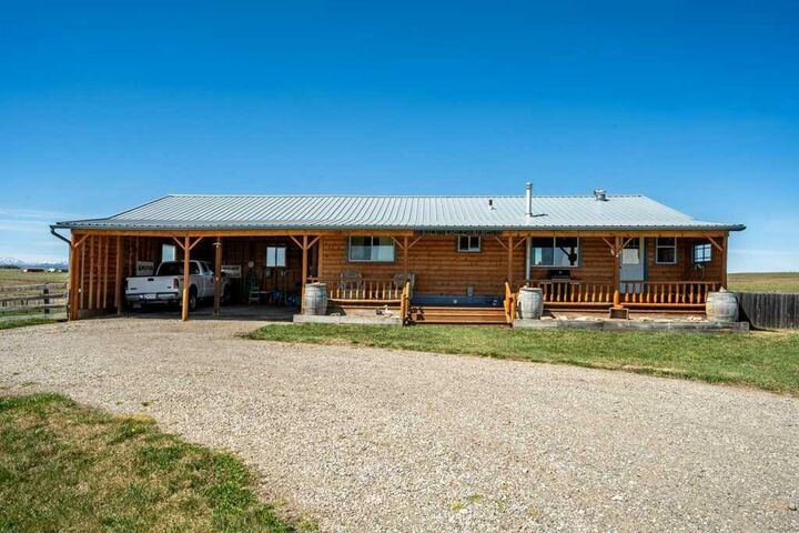 Property Photo:  370065 128 Street W  AB T1S 6B8 
