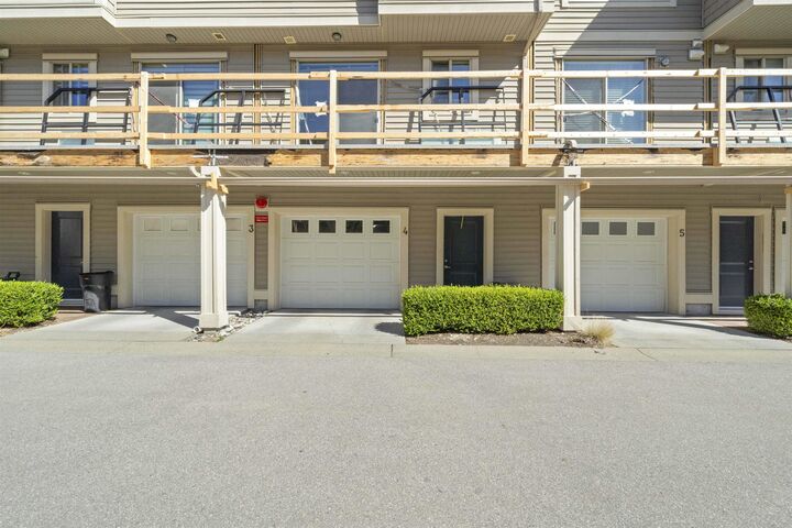 Property Photo: 19752 55A Avenue 4 BC V3A 3X2