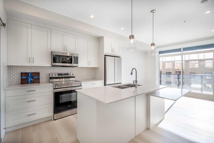 Property Photo: 1802 Mahogany Boulevard SE 7202 AB T3M 4J2