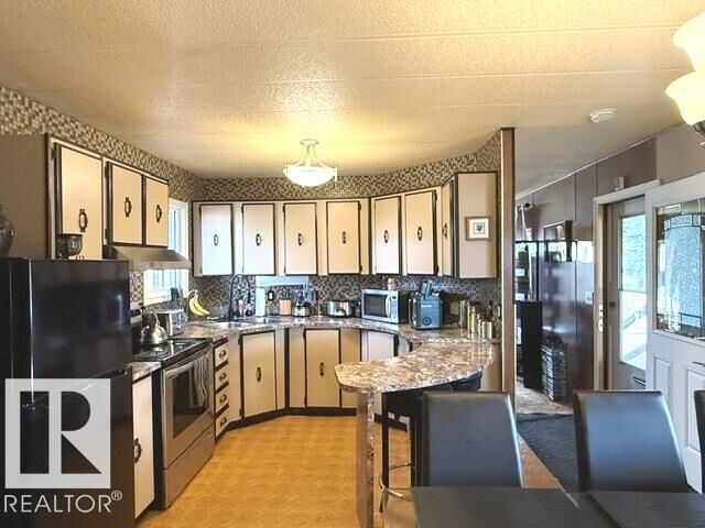 Property Photo: 46 Oakridge Drive NW AB T6P 1H1