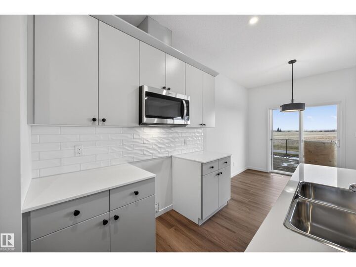 Property Photo: 116 Honeysuckle Gr AB T9E 0V1