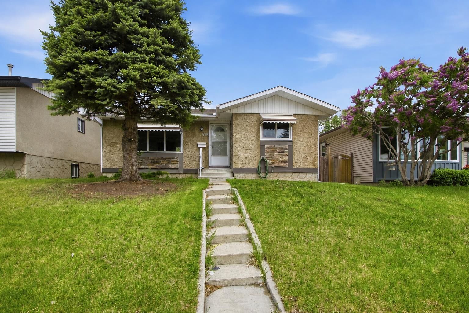 Property Photo:  4112 - 13 Avenue NE  AB T2A 0K8 